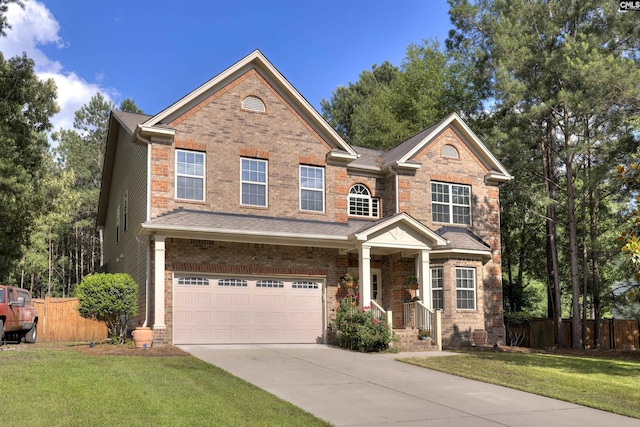 22 Genesis Ln, Camden, SC 29020 - view of front facade with driveway, an attached garage, and brick siding