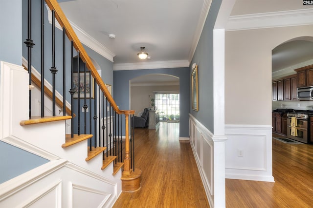 22 Genesis Ln, Camden, SC 29020 - entrance foyer with arched walkways, wood finished floors, ornamental molding, and stairway