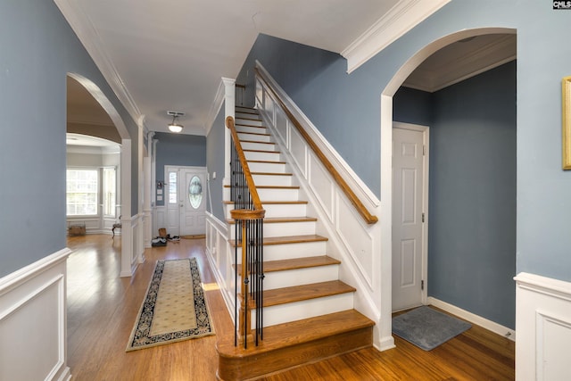 22 Genesis Ln, Camden, SC 29020 - stairway featuring crown molding, wood finished floors, arched walkways, and baseboards