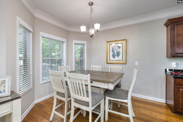 22 Genesis Ln, Camden, SC 29020 - dining room with wood finished floors, baseboards, a chandelier, and crown molding