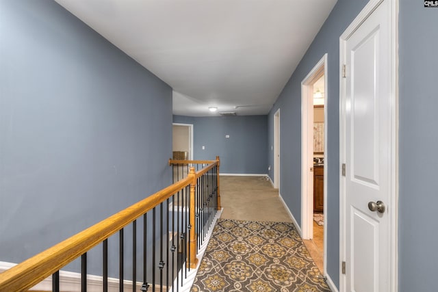 22 Genesis Ln, Camden, SC 29020 - hallway with light colored carpet, an upstairs landing, and baseboards