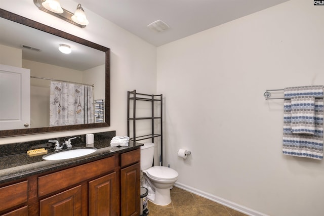 22 Genesis Ln, Camden, SC 29020 - bathroom with toilet, vanity, baseboards, and tile patterned floors