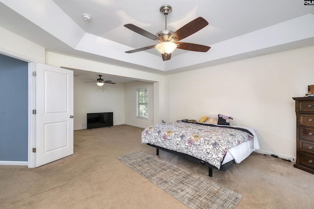 22 Genesis Ln, Camden, SC 29020 - bedroom featuring light carpet, baseboards, a tray ceiling, and a ceiling fan