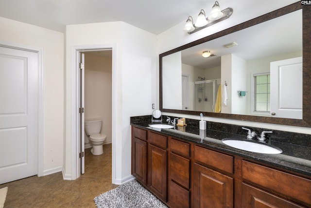 22 Genesis Ln, Camden, SC 29020 - full bathroom featuring a stall shower, tile patterned floors, double vanity, toilet, and baseboards