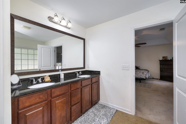 22 Genesis Ln, Camden, SC 29020 - full bath with connected bathroom, double vanity, ceiling fan, and baseboards