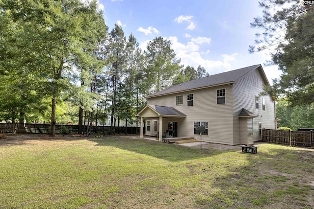 22 Genesis Ln, Camden, SC 29020 - back of property with a patio area and an outdoor fire pit