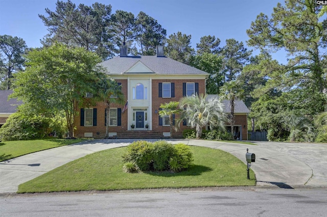 432 Running Fox Rd, Columbia, SC 29223 - colonial inspired home with curved driveway, brick siding, and a front lawn