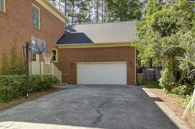 432 Running Fox Rd, Columbia, SC 29223 - view of side of property featuring a shingled roof, brick siding, driveway, and an attached garage
