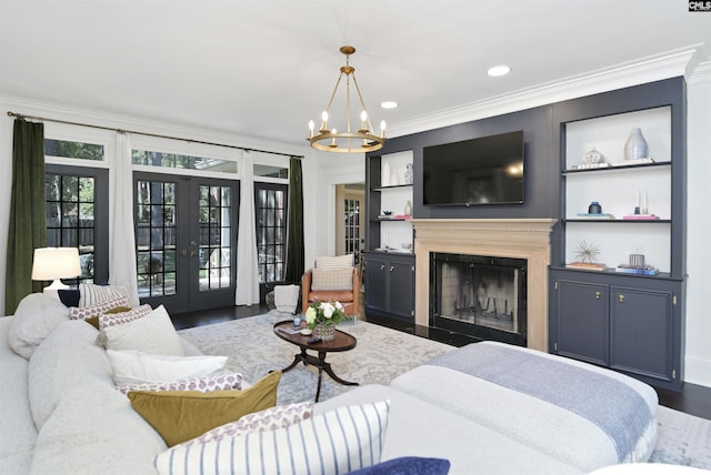 432 Running Fox Rd, Columbia, SC 29223 - living room with french doors, crown molding, wood finished floors, a fireplace with flush hearth, and a chandelier