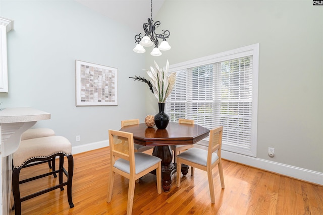 107 Sherborne Ln, Columbia, SC 29229 - dining room with baseboards, light wood-style floors, a chandelier, and lofted ceiling