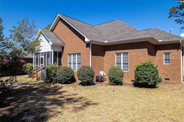 107 Sherborne Ln, Columbia, SC 29229 - view of property exterior with a sunroom, brick siding, roof with shingles, and a lawn