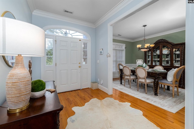 107 Sherborne Ln, Columbia, SC 29229 - foyer entrance with a chandelier, light wood finished floors, crown molding, and baseboards