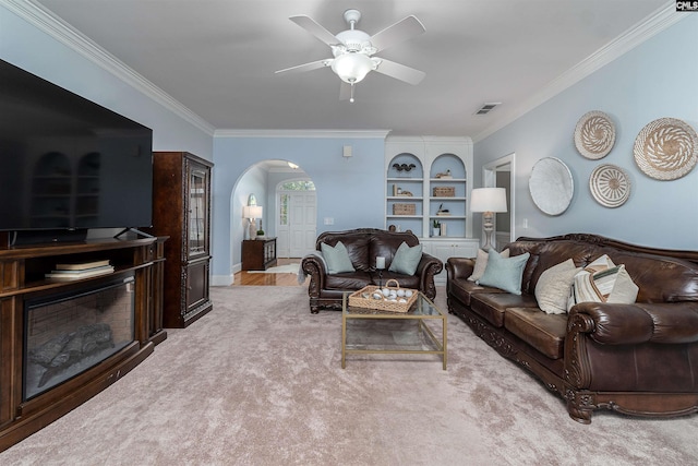 107 Sherborne Ln, Columbia, SC 29229 - living area featuring arched walkways, ornamental molding, ceiling fan, and built in shelves