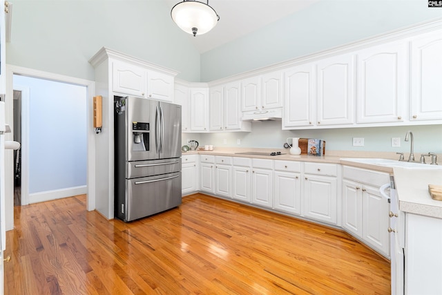 107 Sherborne Ln, Columbia, SC 29229 - kitchen featuring stainless steel fridge with ice dispenser, black electric cooktop, a sink, light countertops, and lofted ceiling
