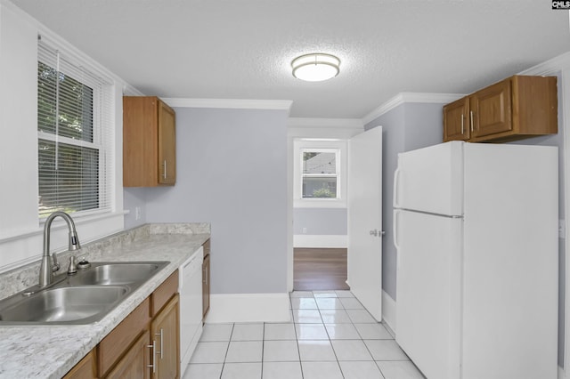 2217 Blossom St, Columbia, SC 29205 - kitchen featuring white appliances, a sink, brown cabinets, light countertops, and a textured ceiling