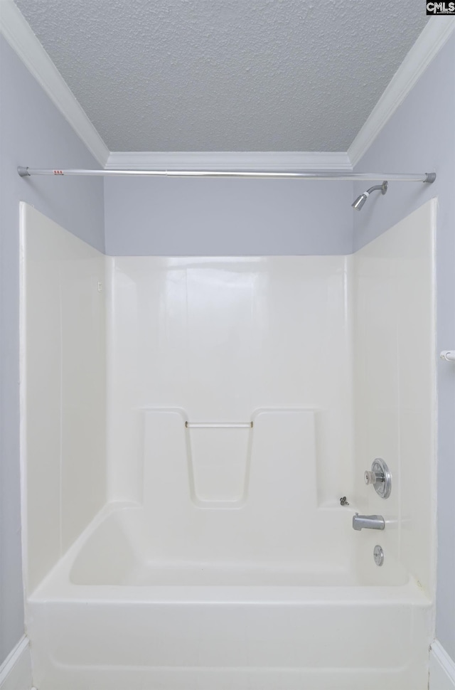 2217 Blossom St, Columbia, SC 29205 - bathroom with a textured ceiling, ornamental molding,  shower combination, and baseboards
