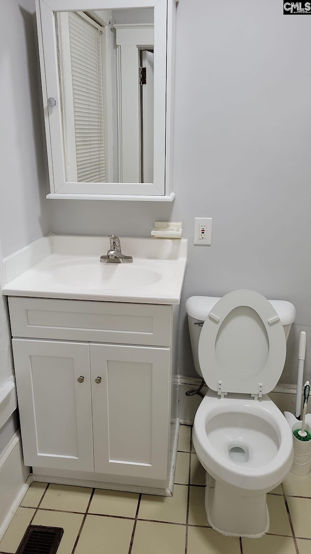 2217 Blossom St, Columbia, SC 29205 - bathroom featuring vanity, toilet, and tile patterned floors