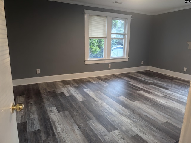 2217 Blossom St, Columbia, SC 29205 - spare room with ornamental molding, dark wood-type flooring, and baseboards