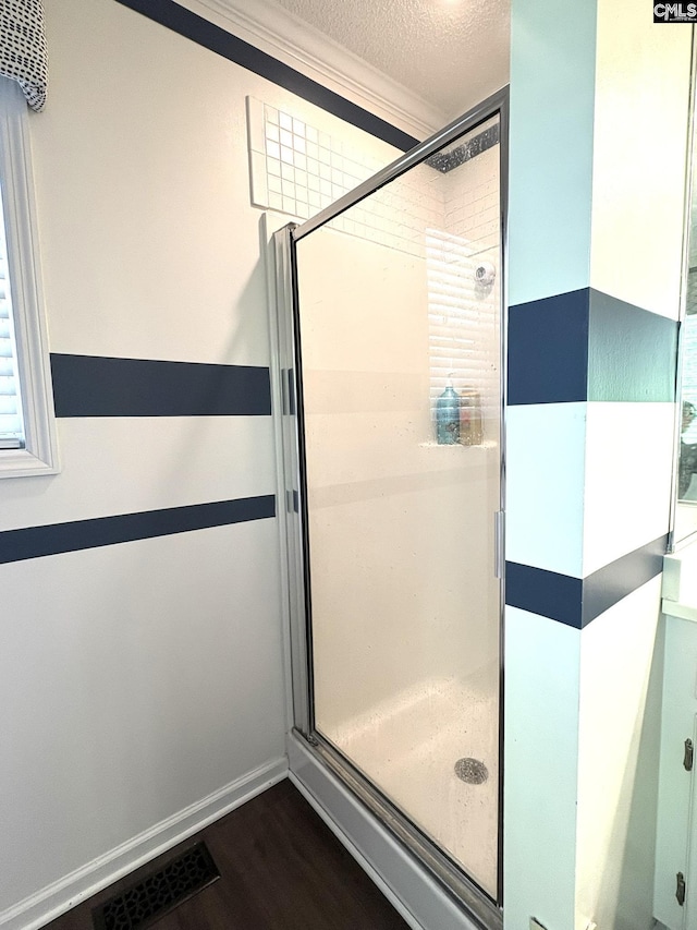 10 Tambridge Ct, Columbia, SC 29229 - full bathroom featuring a shower stall, wood finished floors, a textured ceiling, and crown molding
