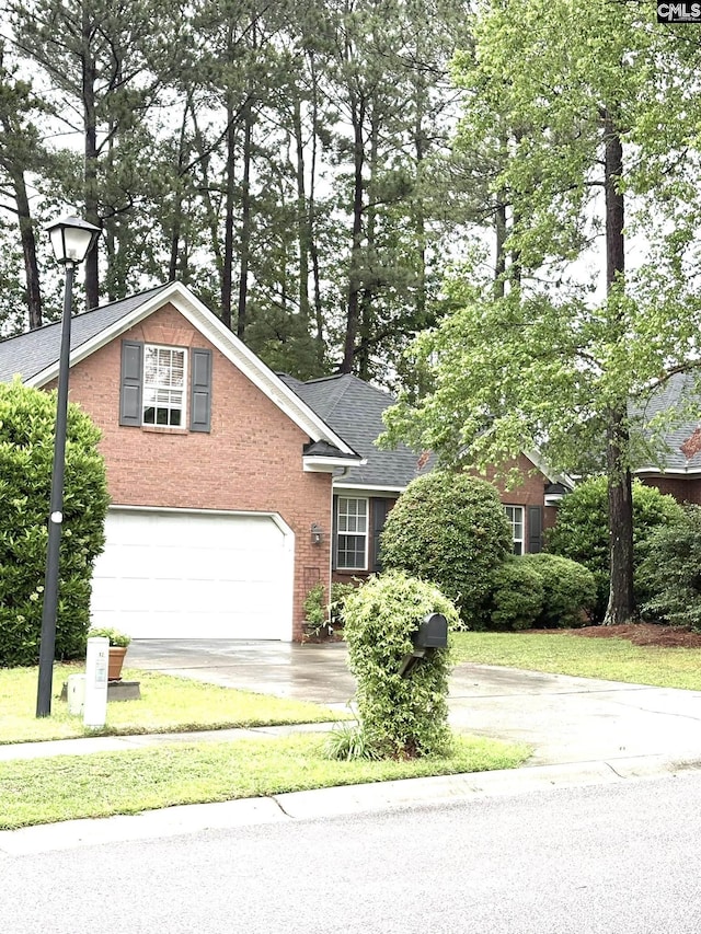 10 Tambridge Ct, Columbia, SC 29229 - view of front of house featuring driveway, an attached garage, and brick siding