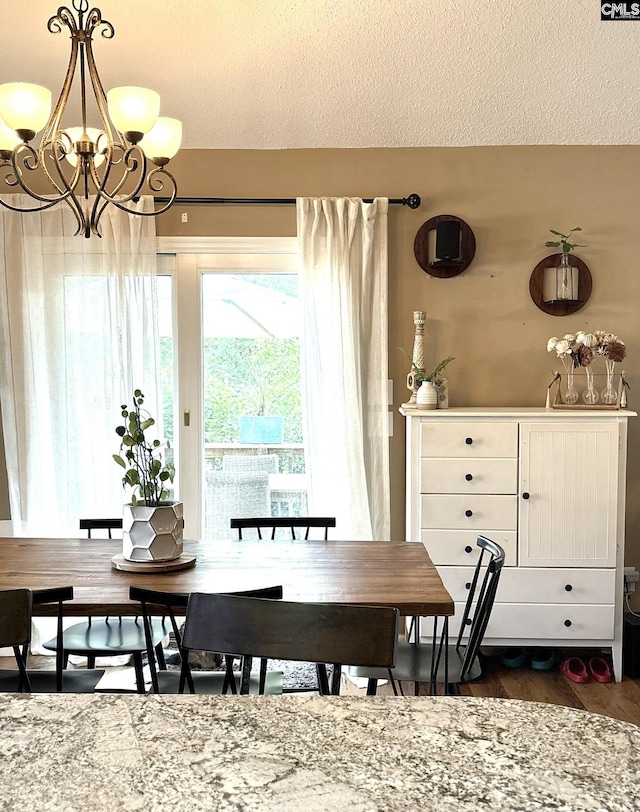 10 Tambridge Ct, Columbia, SC 29229 - dining space featuring a chandelier, a textured ceiling, and dark wood-style flooring