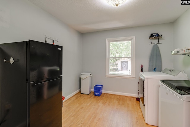 1302 Sunnyhill Dr, Camden, SC 29020 - washroom with washer and clothes dryer, light wood-type flooring, and baseboards