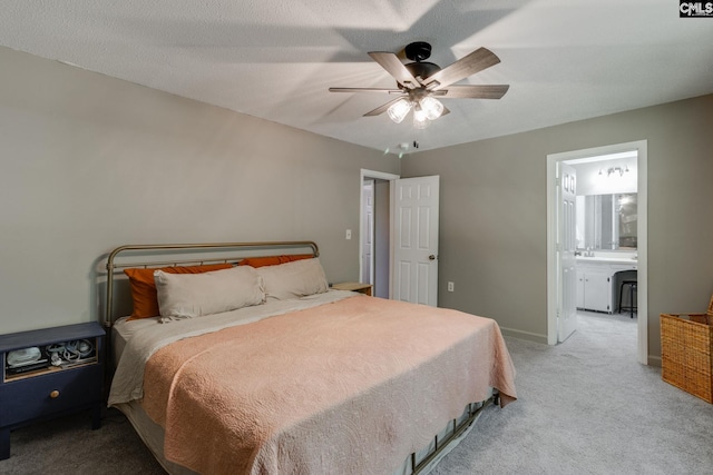 1302 Sunnyhill Dr, Camden, SC 29020 - carpeted bedroom featuring ensuite bath, ceiling fan, and baseboards