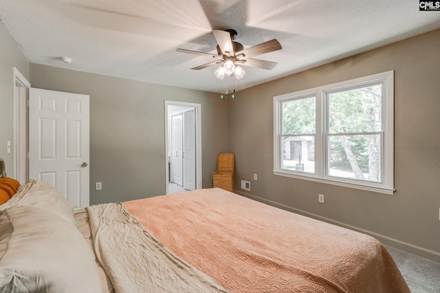 1302 Sunnyhill Dr, Camden, SC 29020 - bedroom featuring carpet floors, a ceiling fan, baseboards, and a textured ceiling