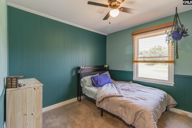 1302 Sunnyhill Dr, Camden, SC 29020 - bedroom featuring carpet floors, ceiling fan, ornamental molding, and wooden walls