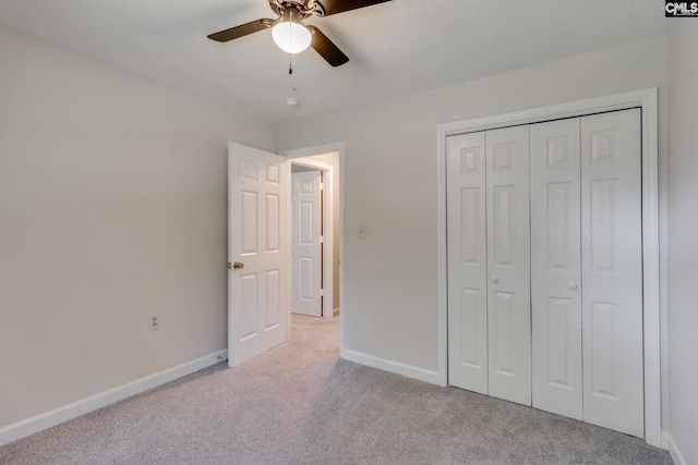 1302 Sunnyhill Dr, Camden, SC 29020 - unfurnished bedroom with light colored carpet, baseboards, a closet, and a ceiling fan