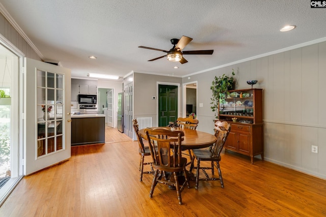 1302 Sunnyhill Dr, Camden, SC 29020 - dining space featuring light wood finished floors, ornamental molding, a ceiling fan, and recessed lighting