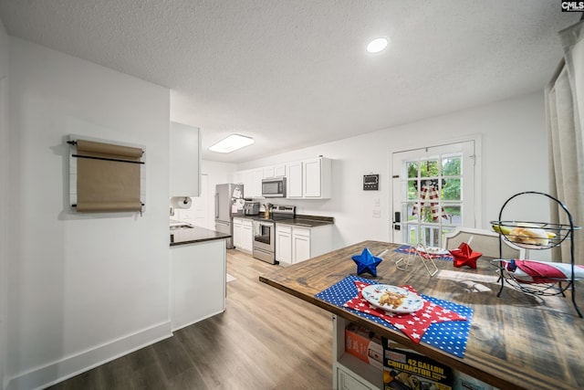 173 Snow Ln, Lexington, SC 29073 - dining space with wood finished floors and a textured ceiling