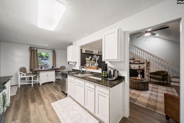 173 Snow Ln, Lexington, SC 29073 - kitchen featuring dishwasher, a textured ceiling, dark wood finished floors, white cabinetry, and a sink