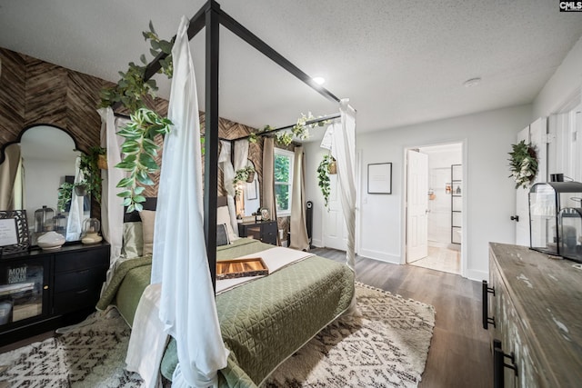 173 Snow Ln, Lexington, SC 29073 - bedroom featuring a textured ceiling, baseboards, and wood finished floors
