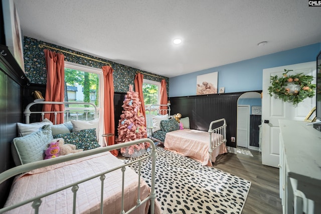173 Snow Ln, Lexington, SC 29073 - bedroom featuring wallpapered walls, wood finished floors, a textured ceiling, wainscoting, and recessed lighting