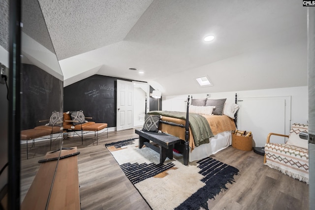 173 Snow Ln, Lexington, SC 29073 - bedroom with lofted ceiling, wood finished floors, a textured ceiling, recessed lighting, and baseboards
