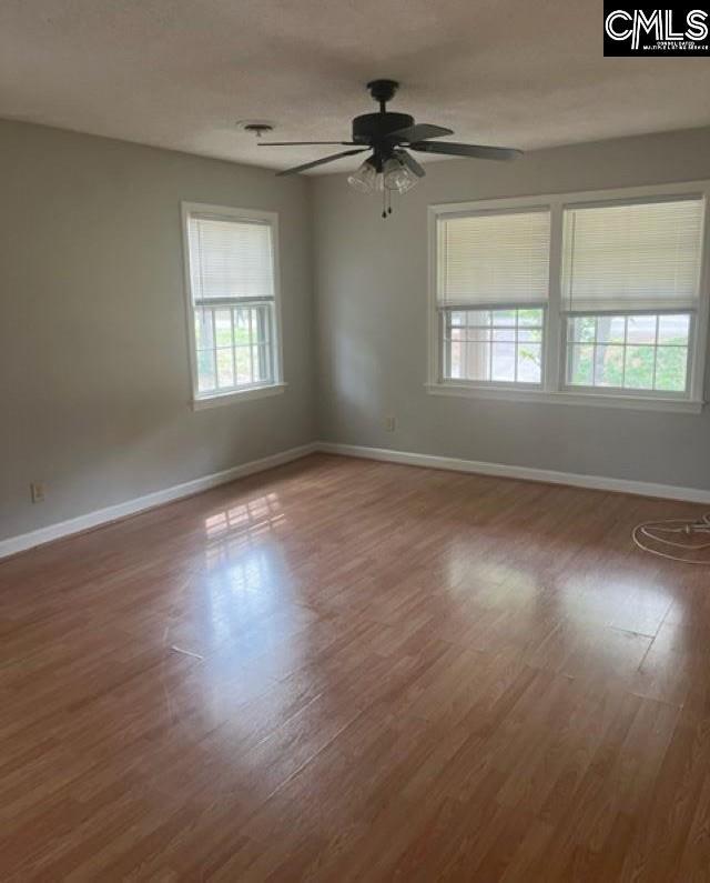 264 Piney Grove Rd, Columbia, SC 29210 - spare room featuring baseboards, a ceiling fan, and wood finished floors