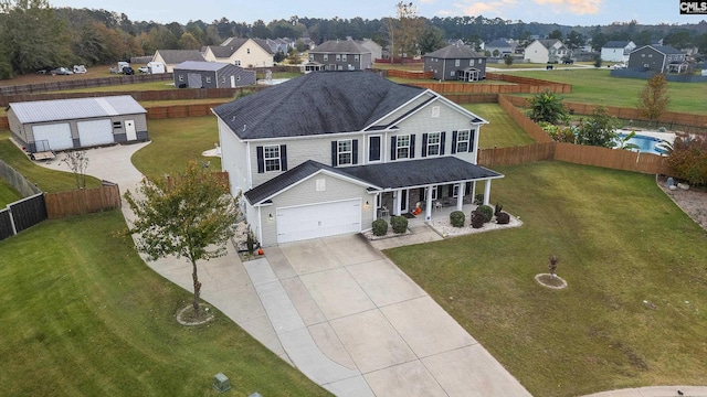 2 Casey Dr, Elgin, SC 29045 - view of front of house with a porch, concrete driveway, a residential view, a garage, and a shingled roof