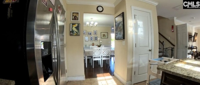 1 Twinspur Ct, Columbia, SC 29229 - hallway with crown molding, a chandelier, stairs, baseboards, and light tile patterned flooring