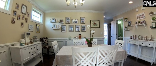 1 Twinspur Ct, Columbia, SC 29229 - dining space featuring a chandelier, ornamental molding, wainscoting, dark wood finished floors, and a decorative wall