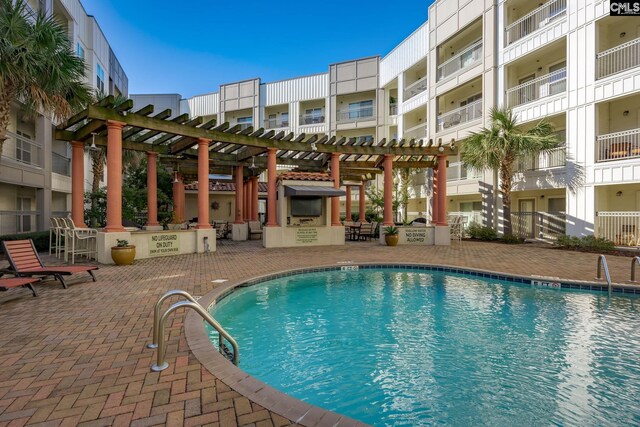 1085 Shop Rd Unit 337, Columbia, SC 29201 - community pool featuring exterior kitchen, a patio area, and a pergola