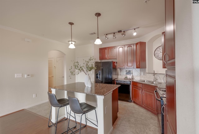 1085 Shop Rd Unit 337, Columbia, SC 29201 - kitchen with black appliances, arched walkways, a sink, a kitchen island, and ornamental molding