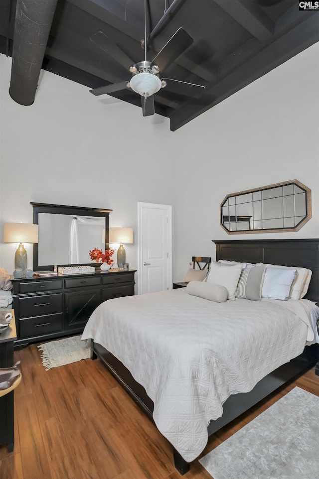 1049 Key Rd Unit 22, Columbia, SC 29201 - bedroom with wood finished floors, beam ceiling, and a ceiling fan