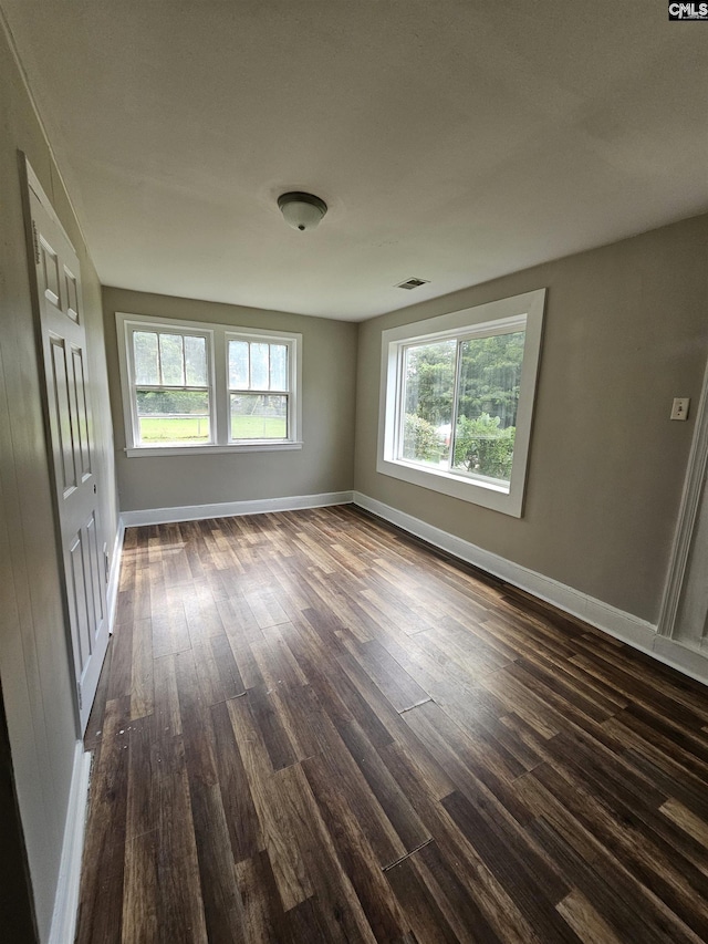 202 Crawford Rd, Columbia, SC 29203 - spare room featuring dark wood-style floors, plenty of natural light, and baseboards