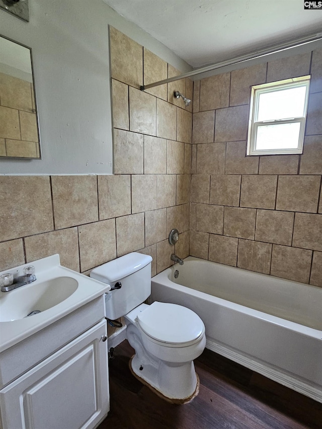202 Crawford Rd, Columbia, SC 29203 - full bath with toilet, tile walls, wood finished floors, shower / bath combination, and vanity