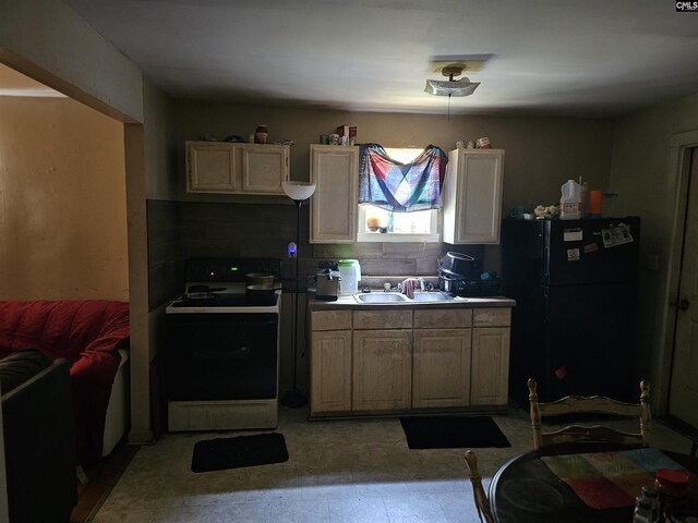 202 Crawford Rd, Columbia, SC 29203 - kitchen with range with electric cooktop, freestanding refrigerator, a sink, and tasteful backsplash