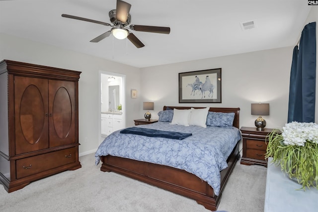206 Carriagebrook Cir, Camden, SC 29020 - bedroom with light colored carpet, ensuite bathroom, a ceiling fan, and baseboards