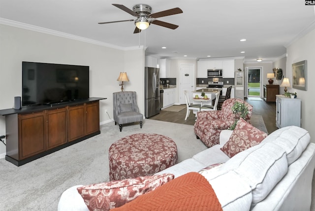 206 Carriagebrook Cir, Camden, SC 29020 - carpeted living area featuring ornamental molding, ceiling fan, recessed lighting, and baseboards