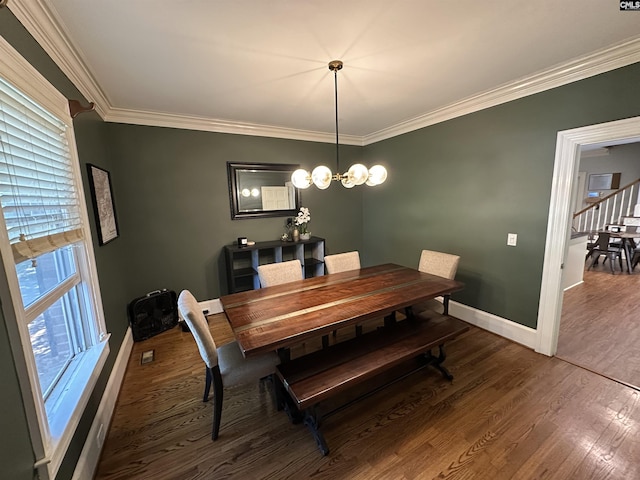 219 Mallet Hill Rd, Columbia, SC 29223 - dining space with wood finished floors, baseboards, ornamental molding, and a chandelier