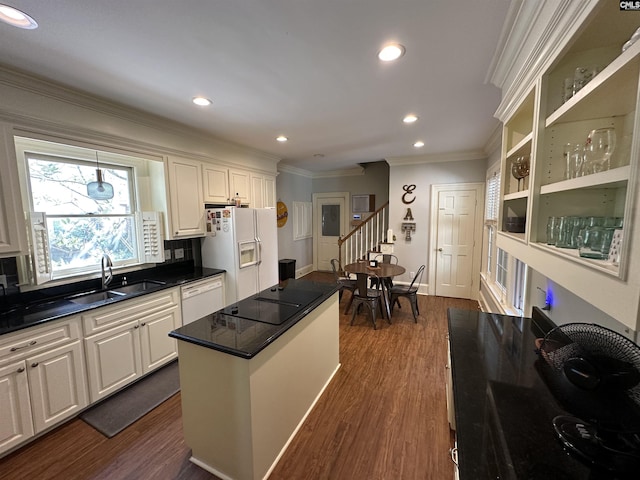 219 Mallet Hill Rd, Columbia, SC 29223 - kitchen featuring a sink, ornamental molding, dark wood-style floors, white cabinets, and dark countertops
